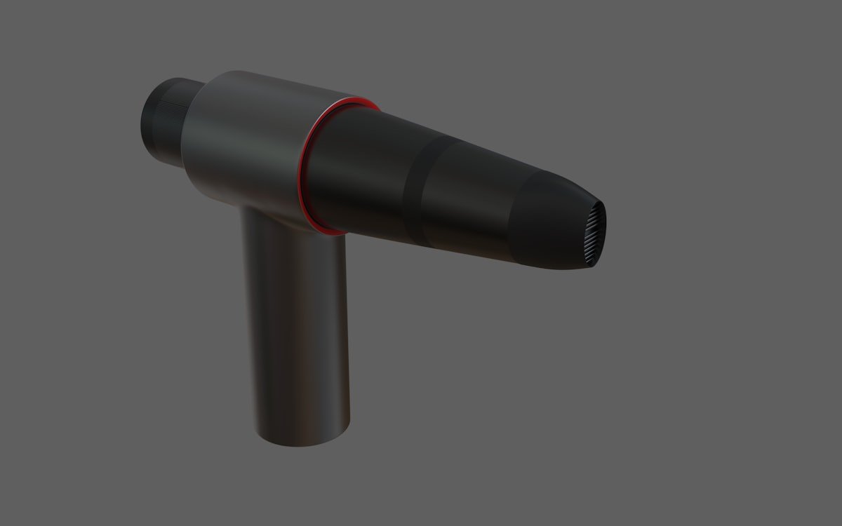 Pistolet de massage percutif utilisé sur un muscle